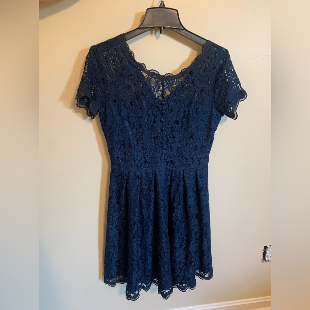 dark blue lace dress missing one button